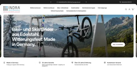 Startseite des INDRA-Shops: Bildslider mit einem Mountainbike an einem Edelstahlständer, darüber die Navigation nach Produktgruppen